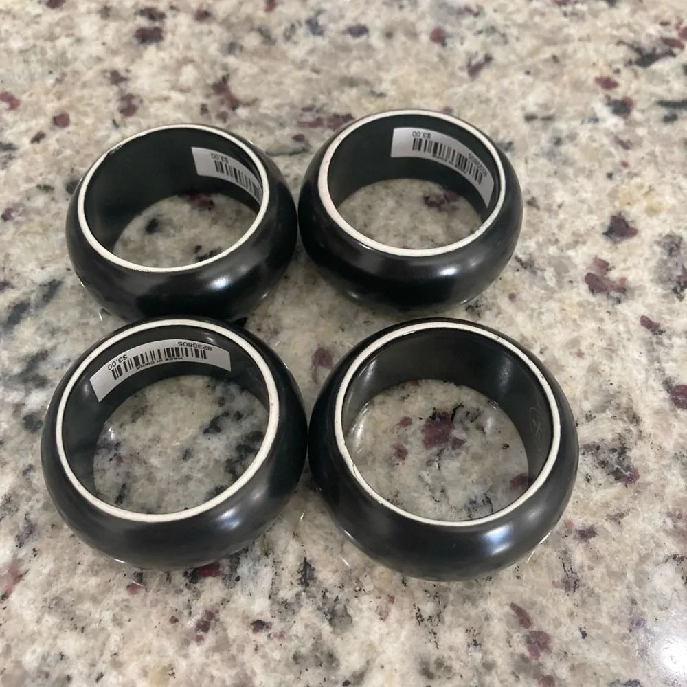 NWT Pier 1 Imports set of 4 black with white on one side ceramic napkin rings